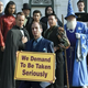 A screenshot from Arrested Development, showing a group of magicians demanding to be taken seriously.